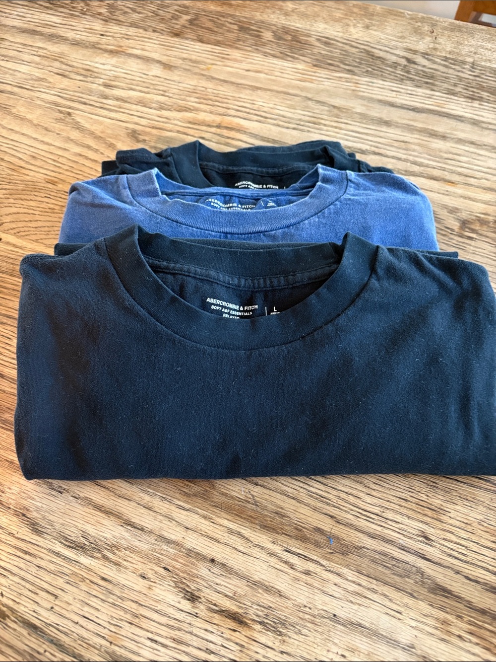Abercrombie and Fitch plain colored t-shirts.